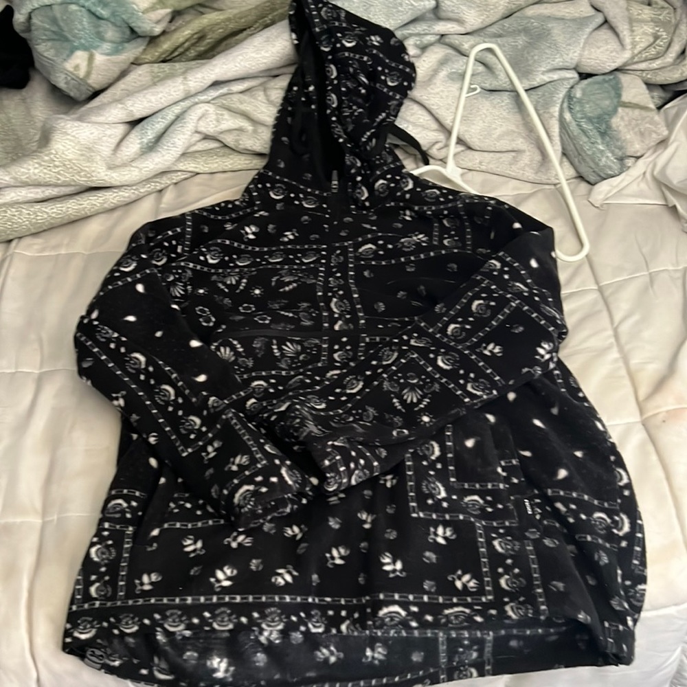 A paisley pattern sweater or A “bandana” style sweater